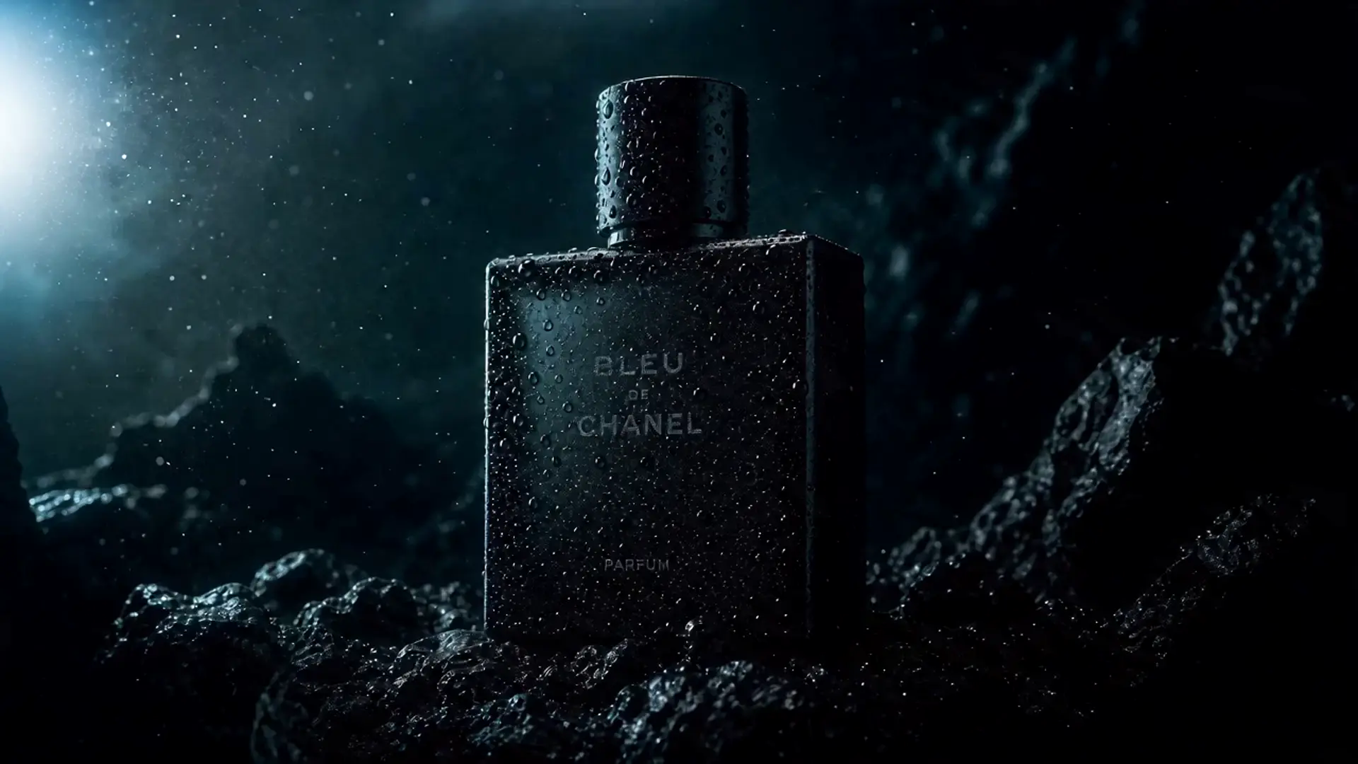 A matte black perfume flacon beaded with water droplets, suspended in a crushed-black abyssal void